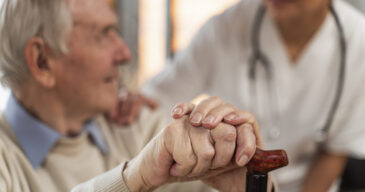 casual-senior-man-home-with-doctor